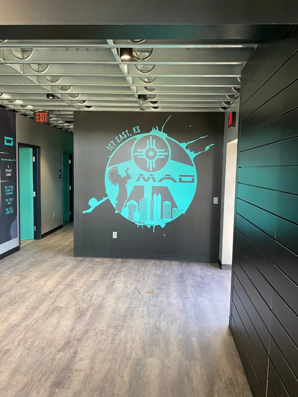 Large-format branded wall graphic installed by Endura
